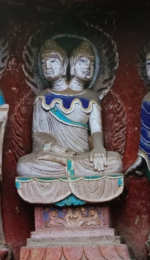 Close view of the double-headed sculpture at Nankan