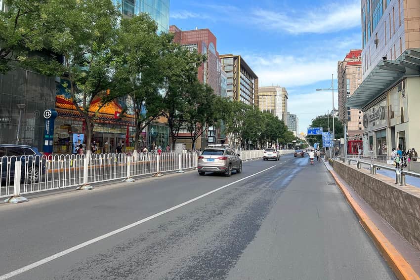 Wide contemporary commercial street along Jinyu Hutong in Beijing