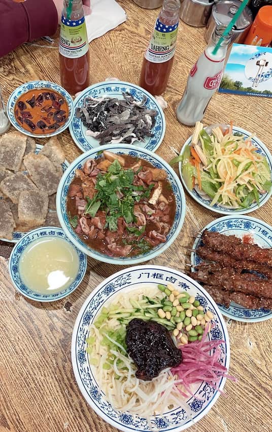 Luzhu bowl at the center of a larger Beijing restaurant meal
