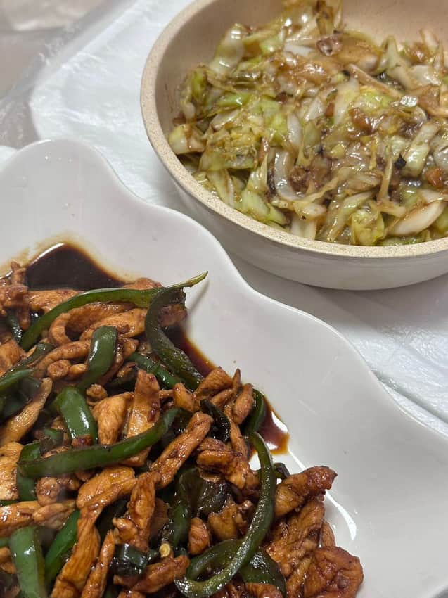Chili-and-meat stir-fry beside another Hunan dish