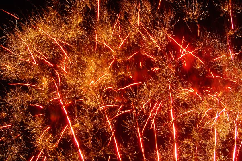 Red and gold fireworks trails over Liuyang