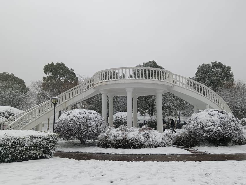 Snow-covered pedestrian bridge on Orange Isle