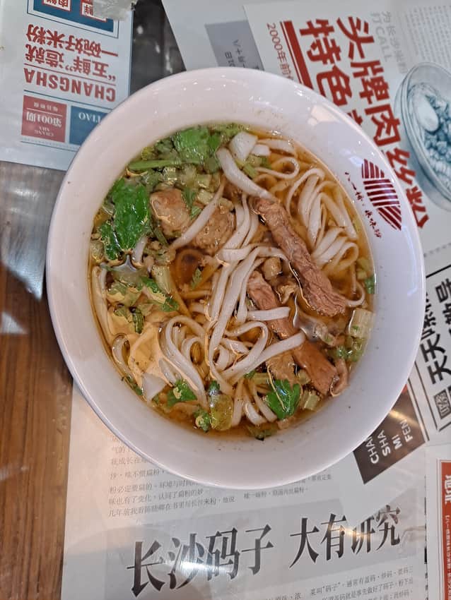 Top view of a bowl of Changsha rice noodles