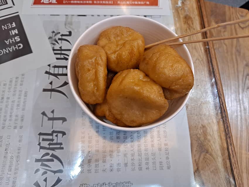 Bowl of glossy golden tangyou baba