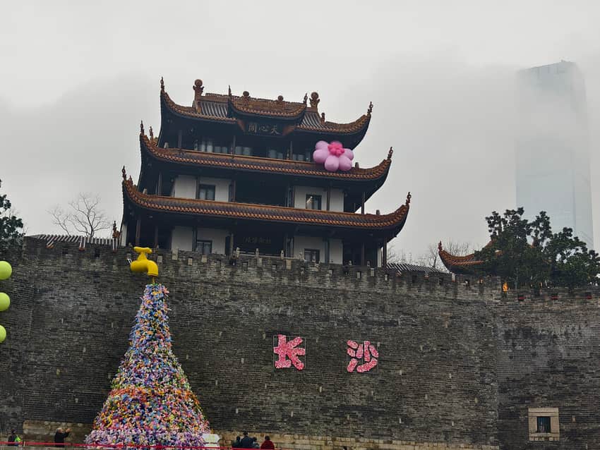 Tianxin Pavilion above the city wall in mist