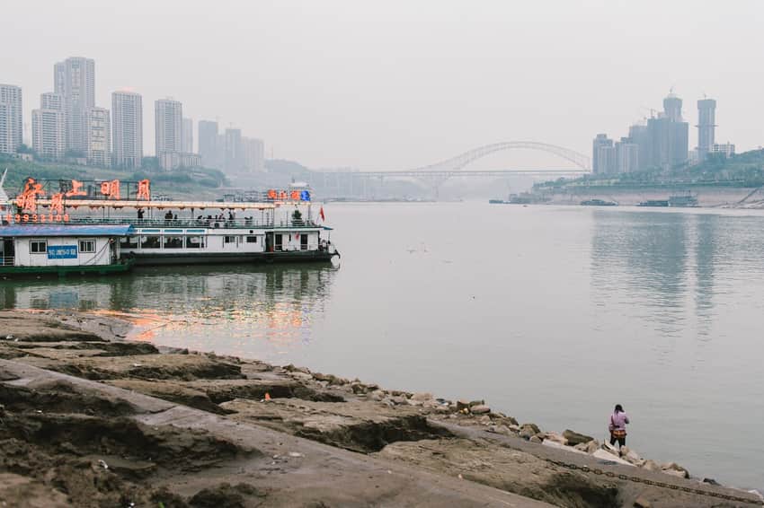 Yangtze and Jialing river junction with boats and bridge