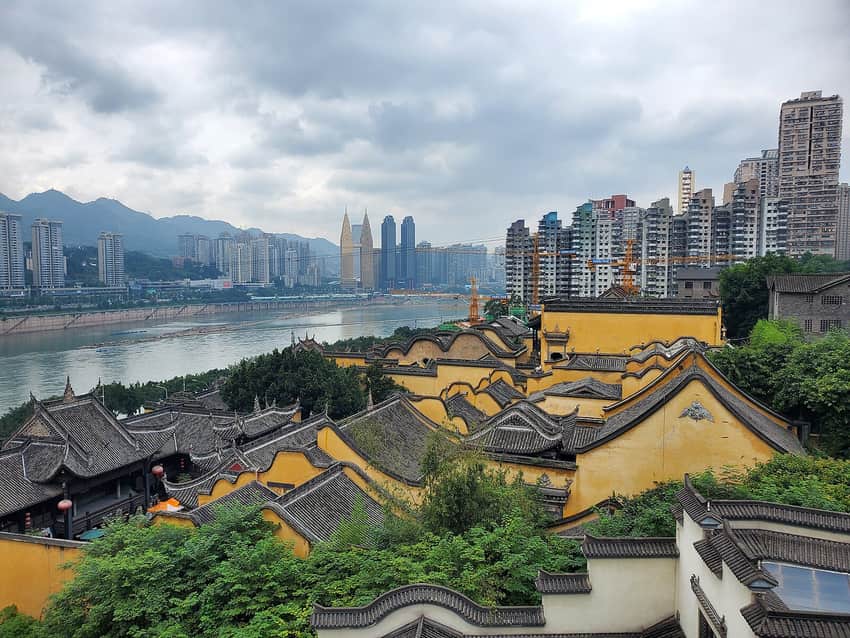 Huguang Guild Hall roofs against central Chongqing's river-city backdrop