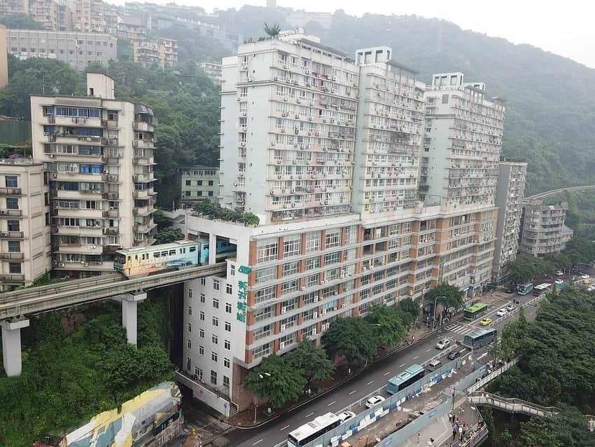 Line 2 monorail train passing through the Liziba Station building