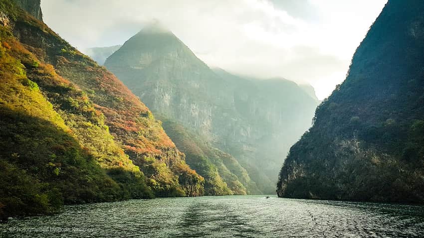 Sunlit cliffs and river passage in Qutang Gorge