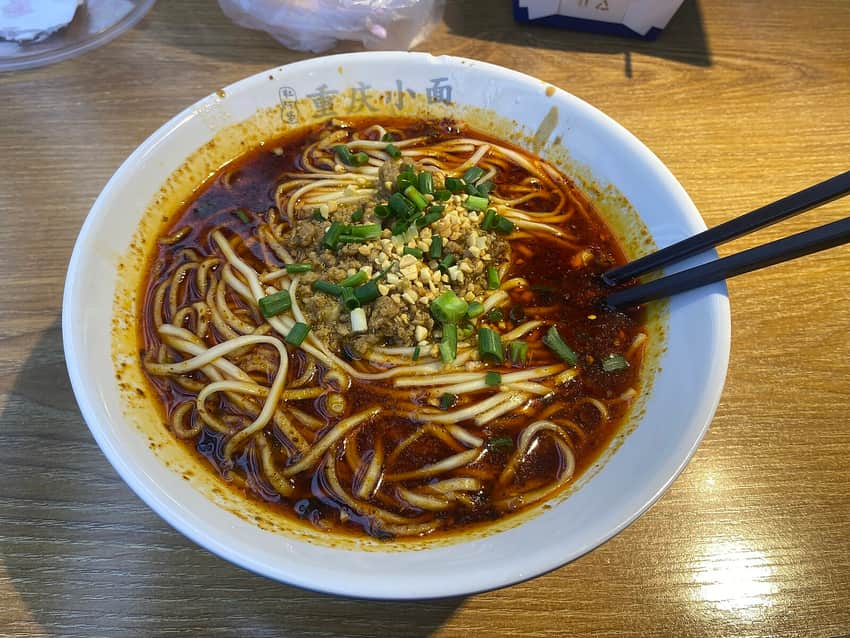 One bowl of Chongqing xiaomian with greens and peanuts