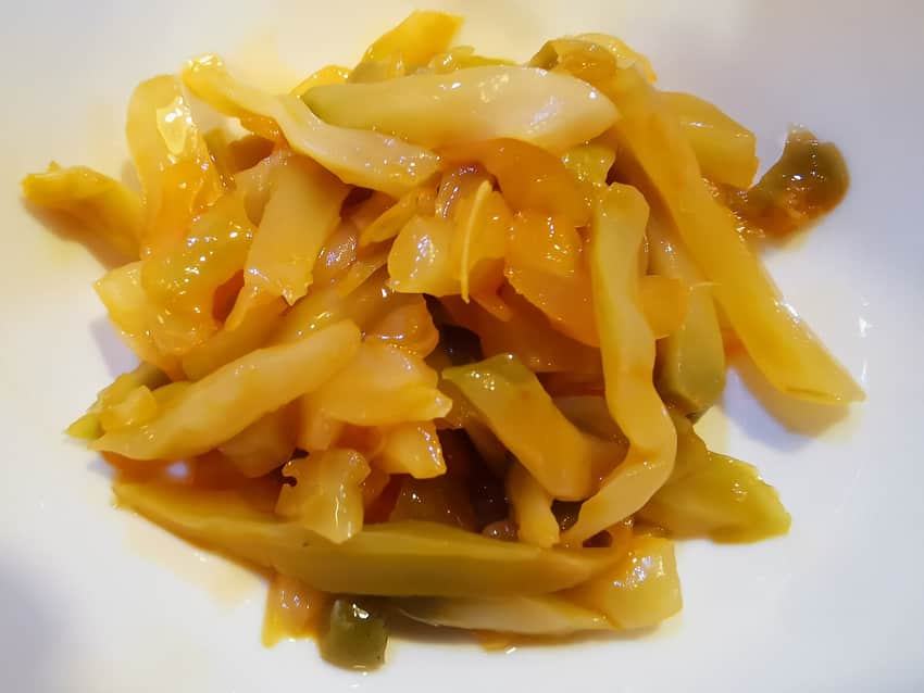 Sliced Fuling zhacai served beside its package