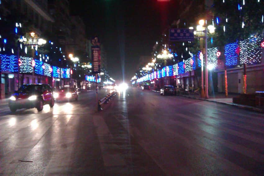 Older night photograph of a lit street in Dazhu County