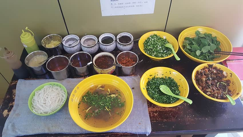 Context photograph of a Kunming rice-noodle bowl, not Mianzhu rice noodles
