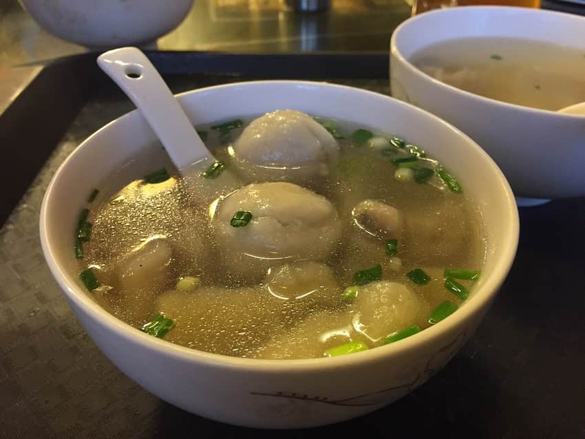 Bowl of Fuzhou fish balls and other items in clear broth