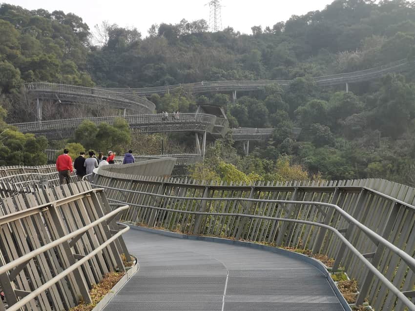 Elevated walkway through wooded hills on a Fuzhou urban forest trail