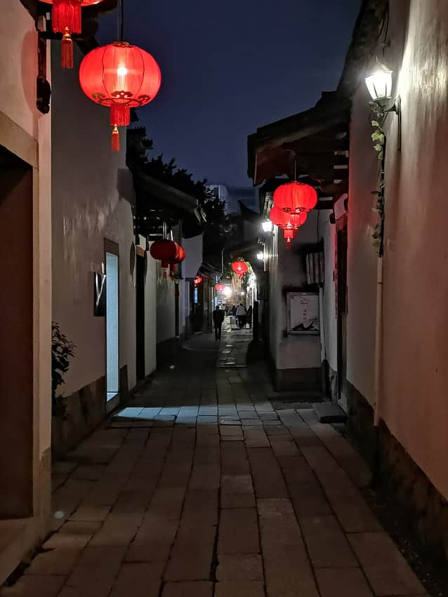 Lantern-lit lane in Three Lanes and Seven Alleys at night