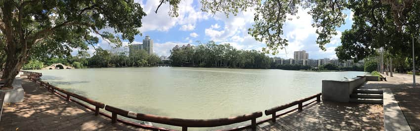 Wide panorama across Fuzhou West Lake from a shaded waterfront path