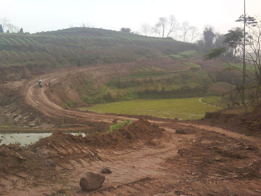 Dated rough road and terraced fields in Wusheng County