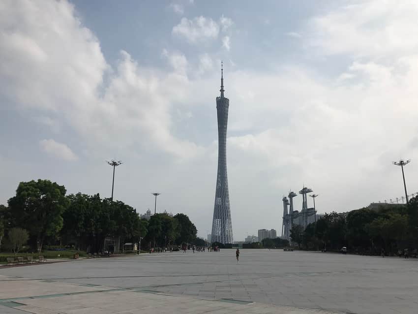Canton Tower rising over an open plaza under cloud