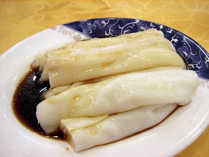 Soft rice noodle rolls with dark soy-based sauce