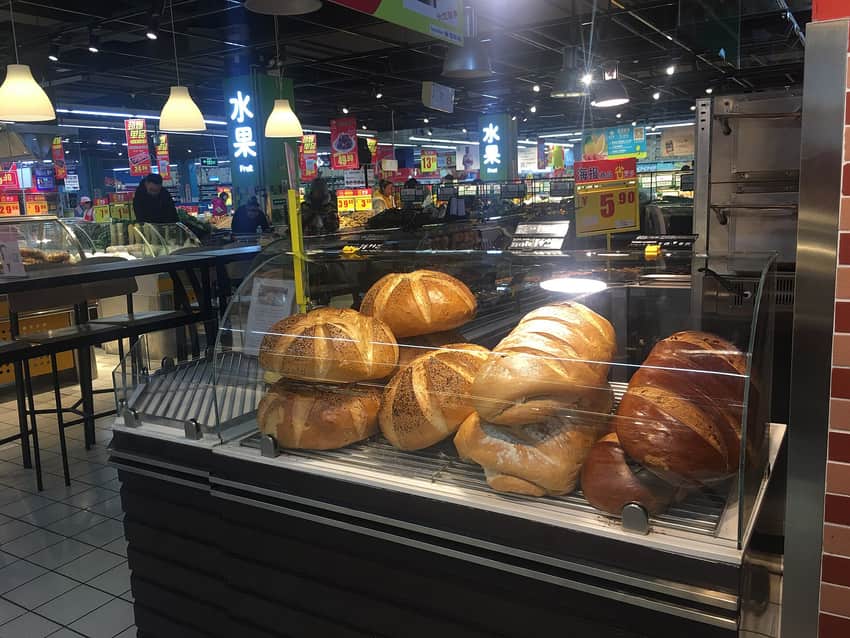Large dalieba loaves displayed in a Harbin supermarket