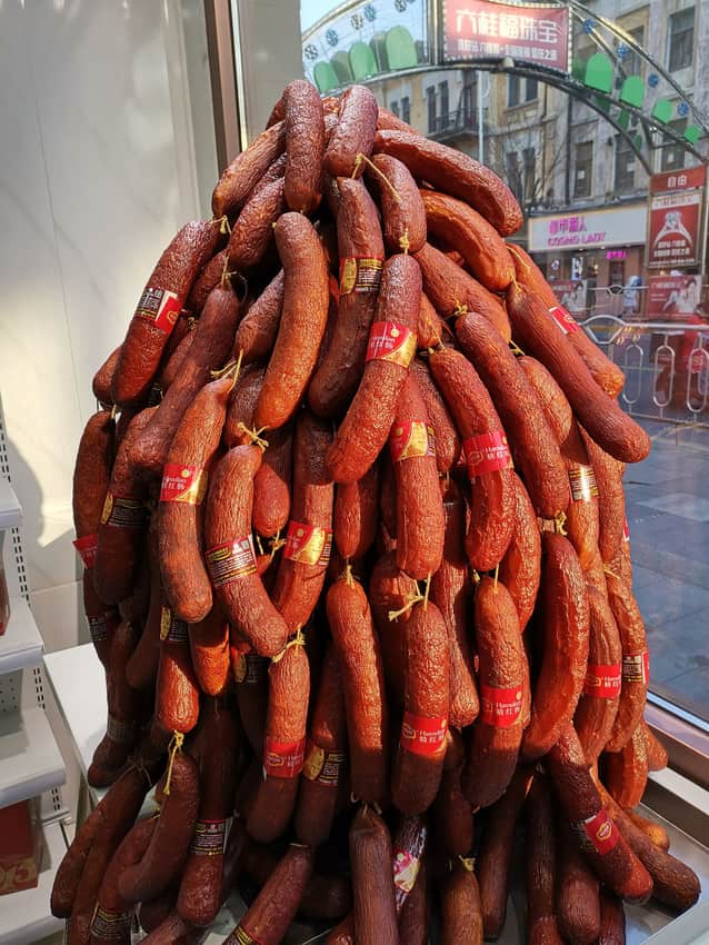 Large hanging retail display of red sausages in Harbin