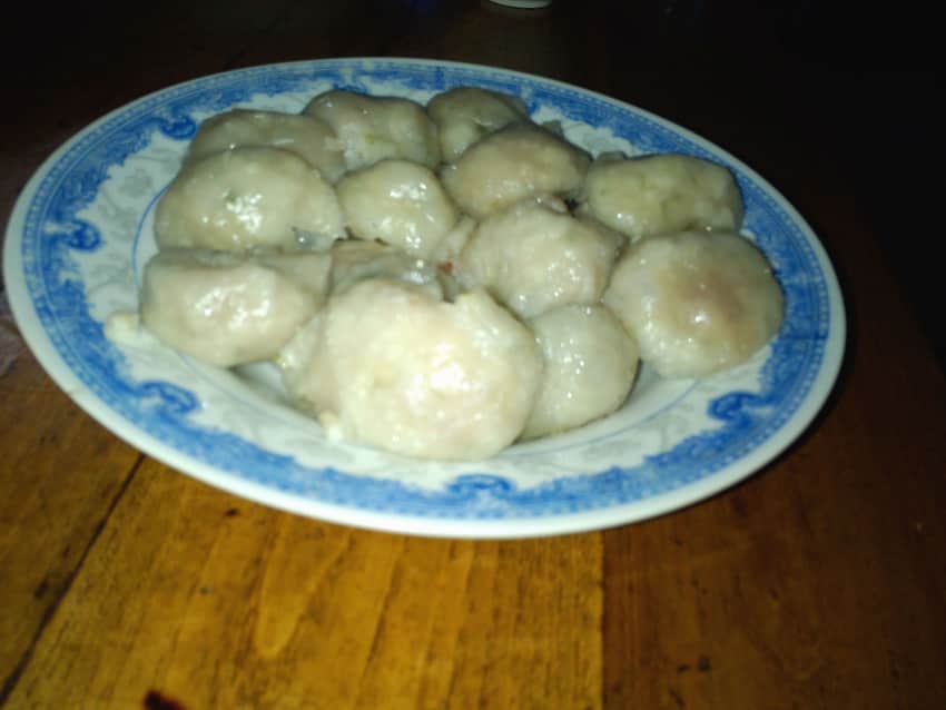 Plate of round dumpling-like food identified as Zhuangmu meatballs