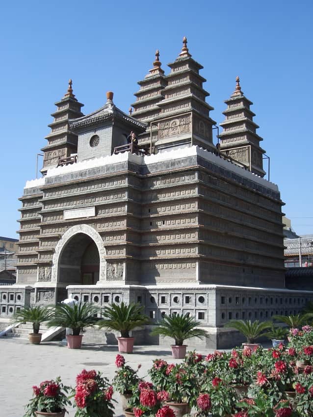 Carved Five Pagoda Temple monument with five towers and visitor platform