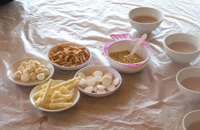 Bowls of milk tea with grain, dairy and fried accompaniments