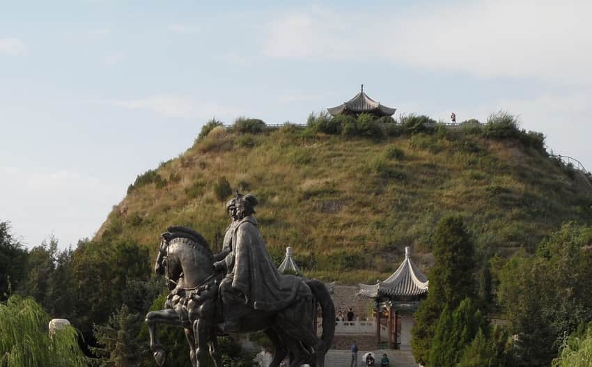 Modern equestrian sculpture, mound, pavilion and visitors at Zhaojun Museum