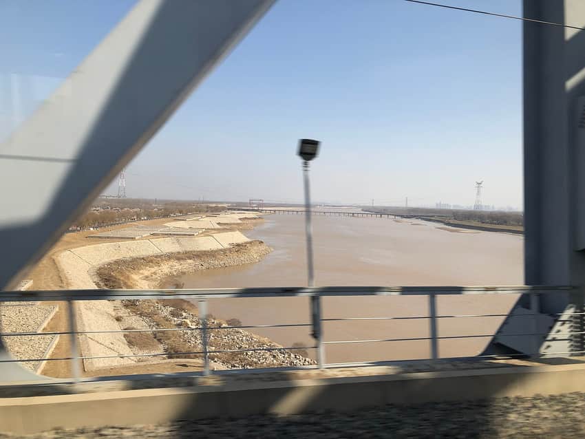 Yellow River channel and engineered bank viewed from a train crossing