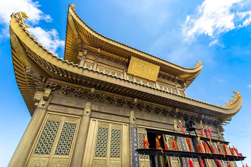 Close view of the Golden Summit building and incense stand