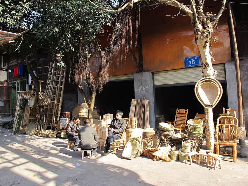 Bamboo baskets and furniture displayed on a street in Qingxi, Qianwei