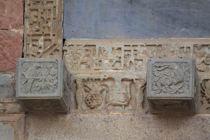 Carved architectural detail at Wangshan Tuku in Xinjian District