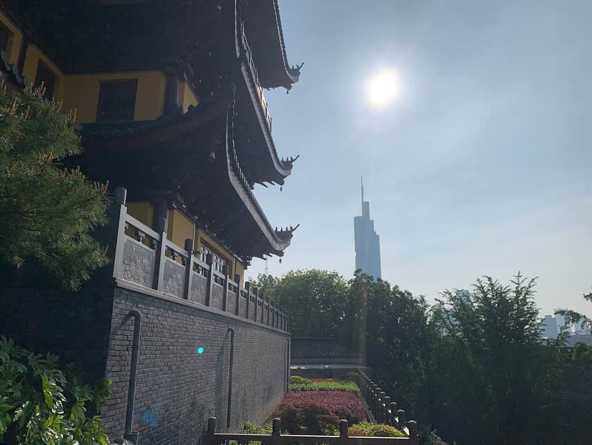 Jiming Temple buildings with contemporary towers behind in 2024