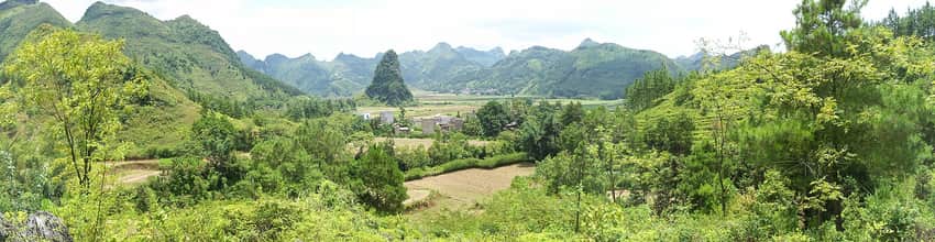 Fields and settlement beneath karst peaks in Wuming District
