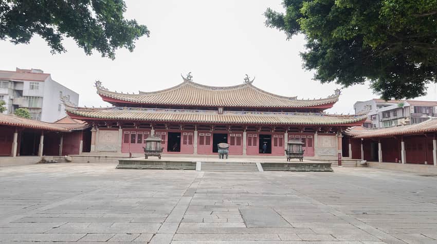 Symmetrical ceremonial hall across the paved courtyard of Quanzhou Confucian Temple
