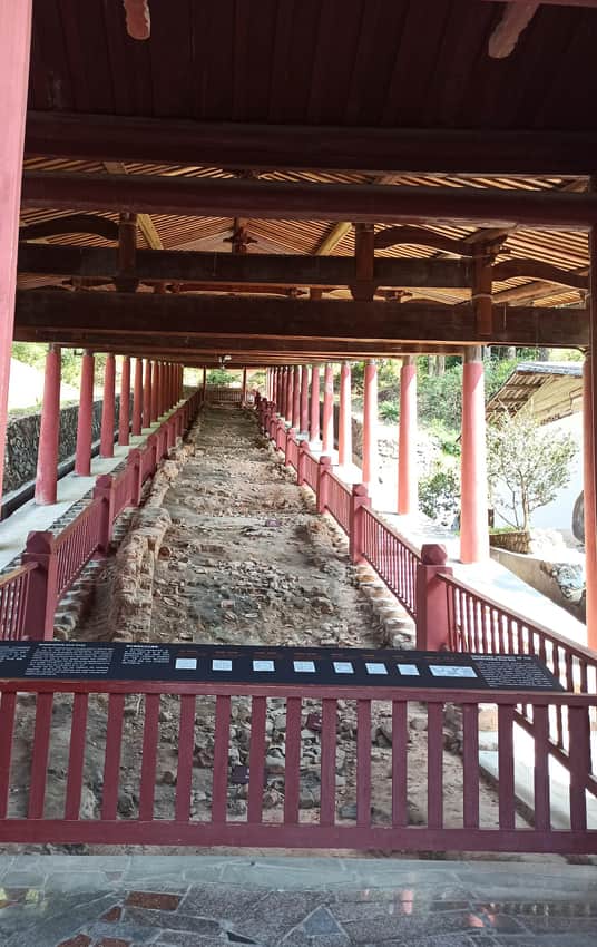 Long exposed Dehua kiln remains under a modern timber protective shelter