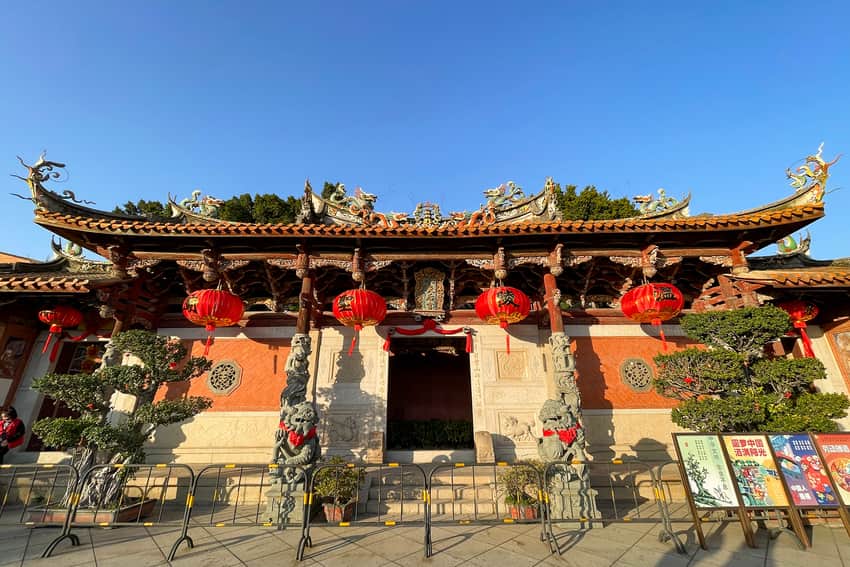 Ornate hall facade, lanterns and stone columns at Tianhou Temple in Quanzhou