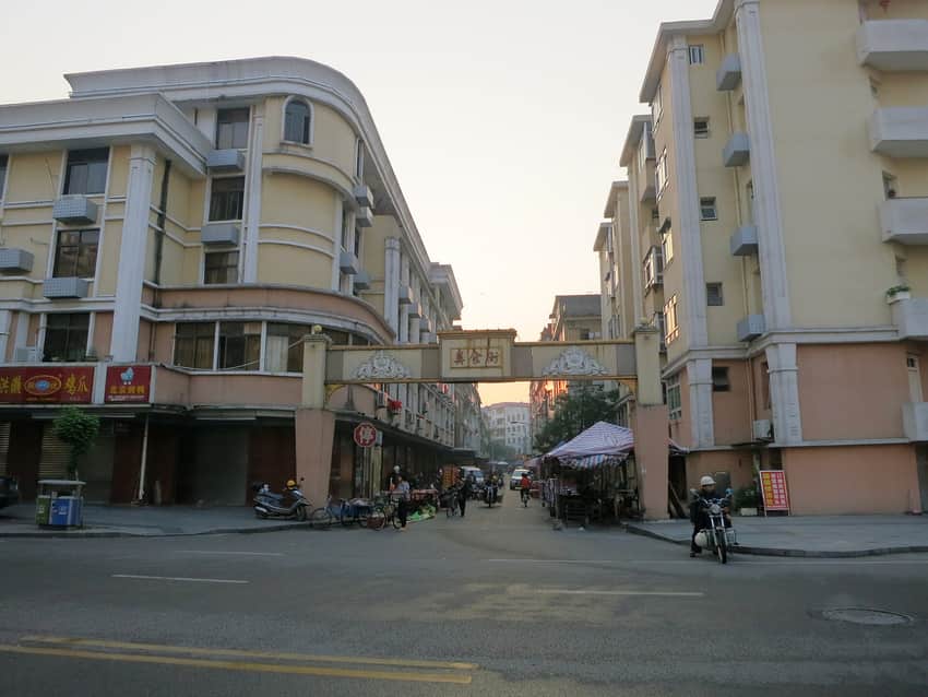 Food-street entrance, small stalls and scooters in Yongchun in 2015