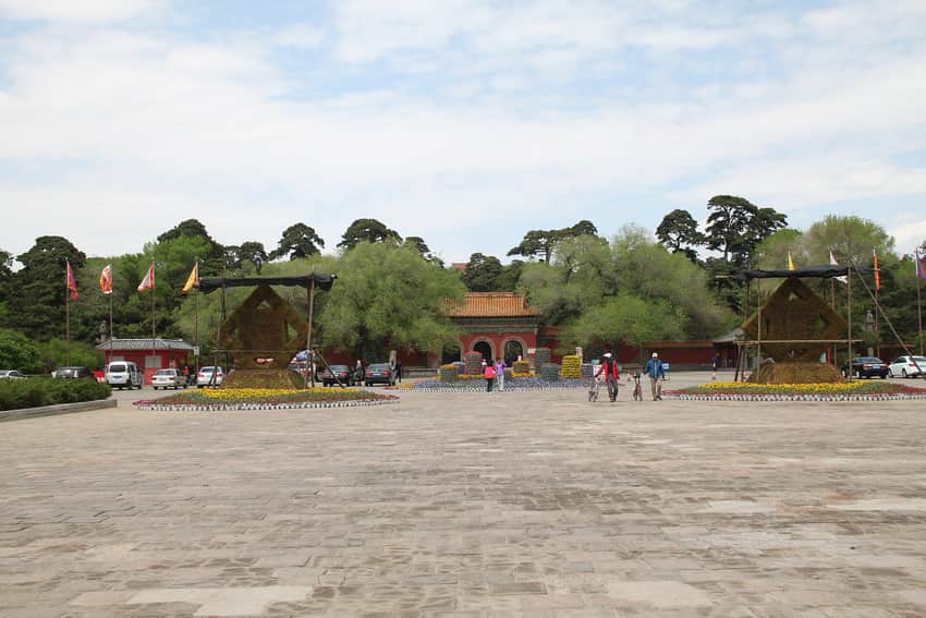 Paved approach, gate, pines and visitors at Fuling in 2014