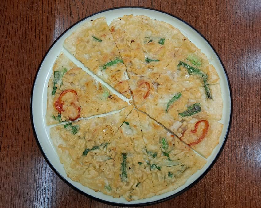Cut seafood-and-scallion pancake served in Shenyang's Xita area