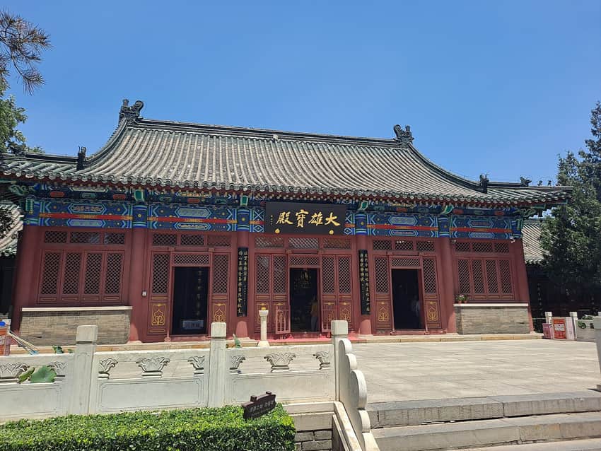 Main hall facade, courtyard and visitors at Linji Temple in Zhengding