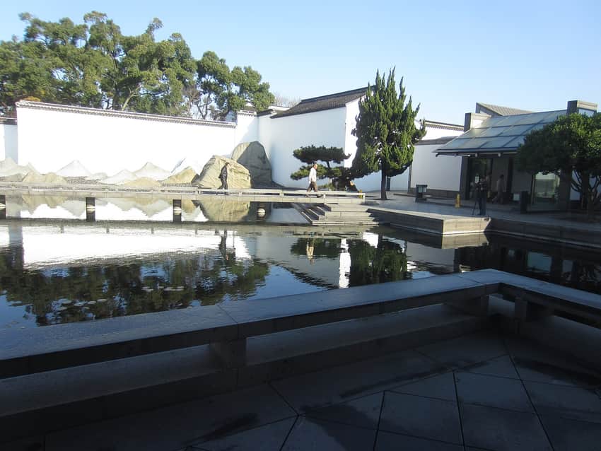 White walls, dark roof lines and water at Suzhou Museum