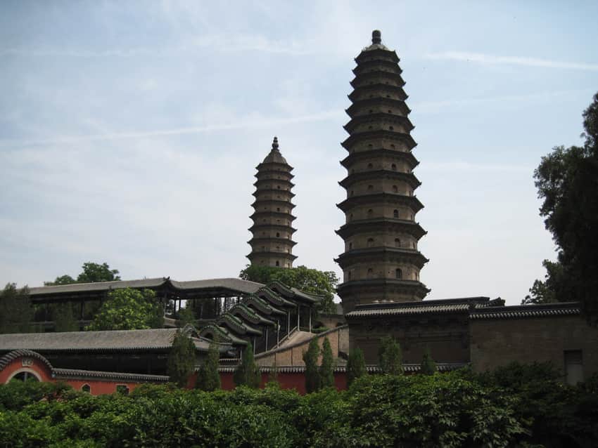 Dated view of the paired brick pagodas above Yongzuo Temple roofs