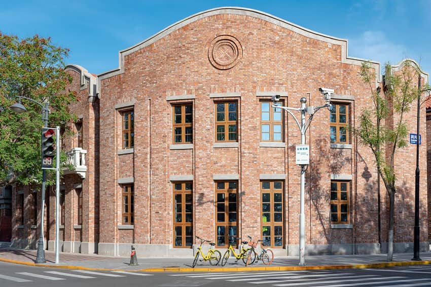 Red-brick corner house and working street in Tianjin Five Great Avenues