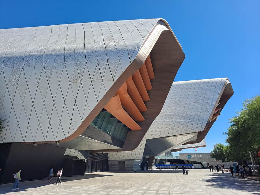Folded silver-white exterior and visitor approach of the National Maritime Museum