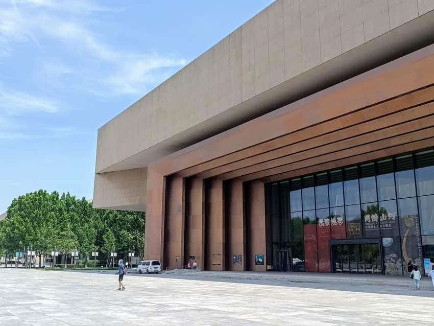 Modern exterior, entrance steps and exhibition banners at Tianjin Museum