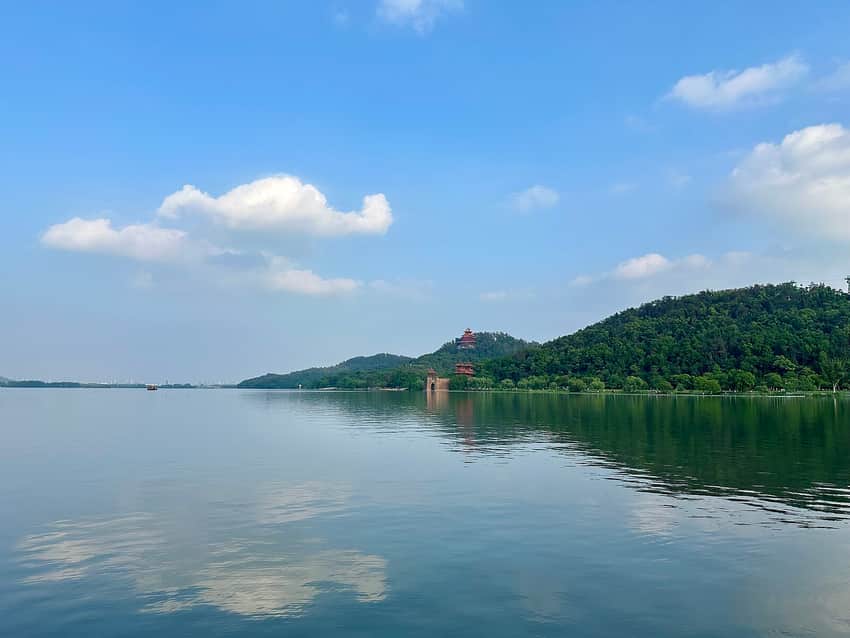 East Lake water and wooded Mount Mo under blue sky