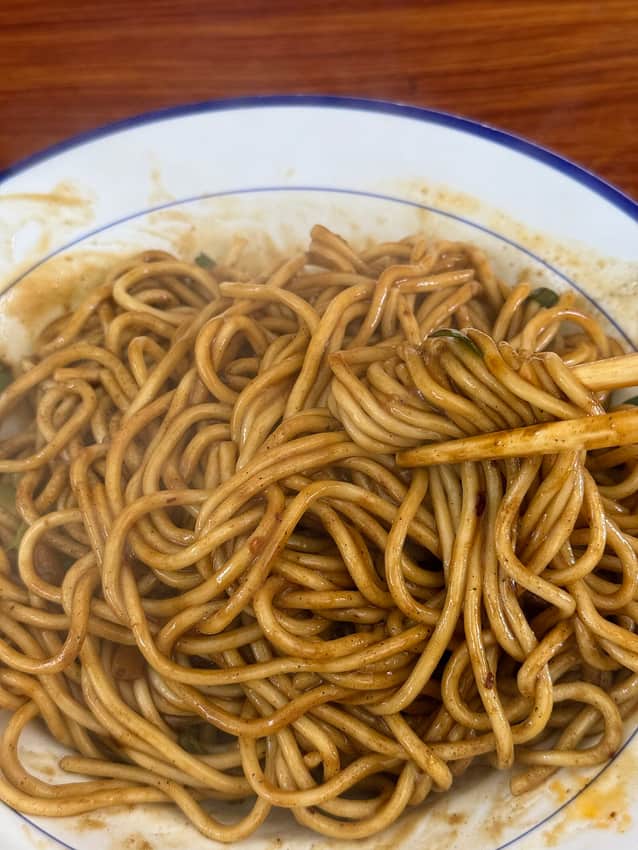 Close view of a bowl of mixed hot-dry noodles